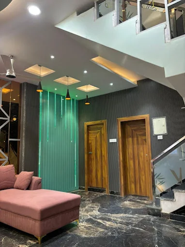 Modern two-story house with garage, balcony, lights, and two cars.